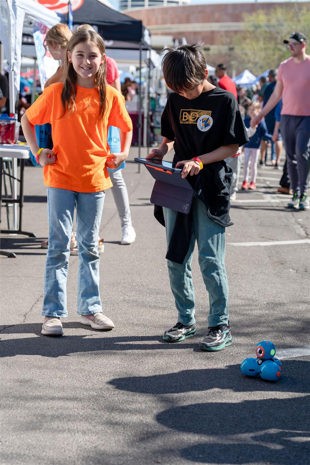 Students work with an OzBot used to learn basic coding skills.
